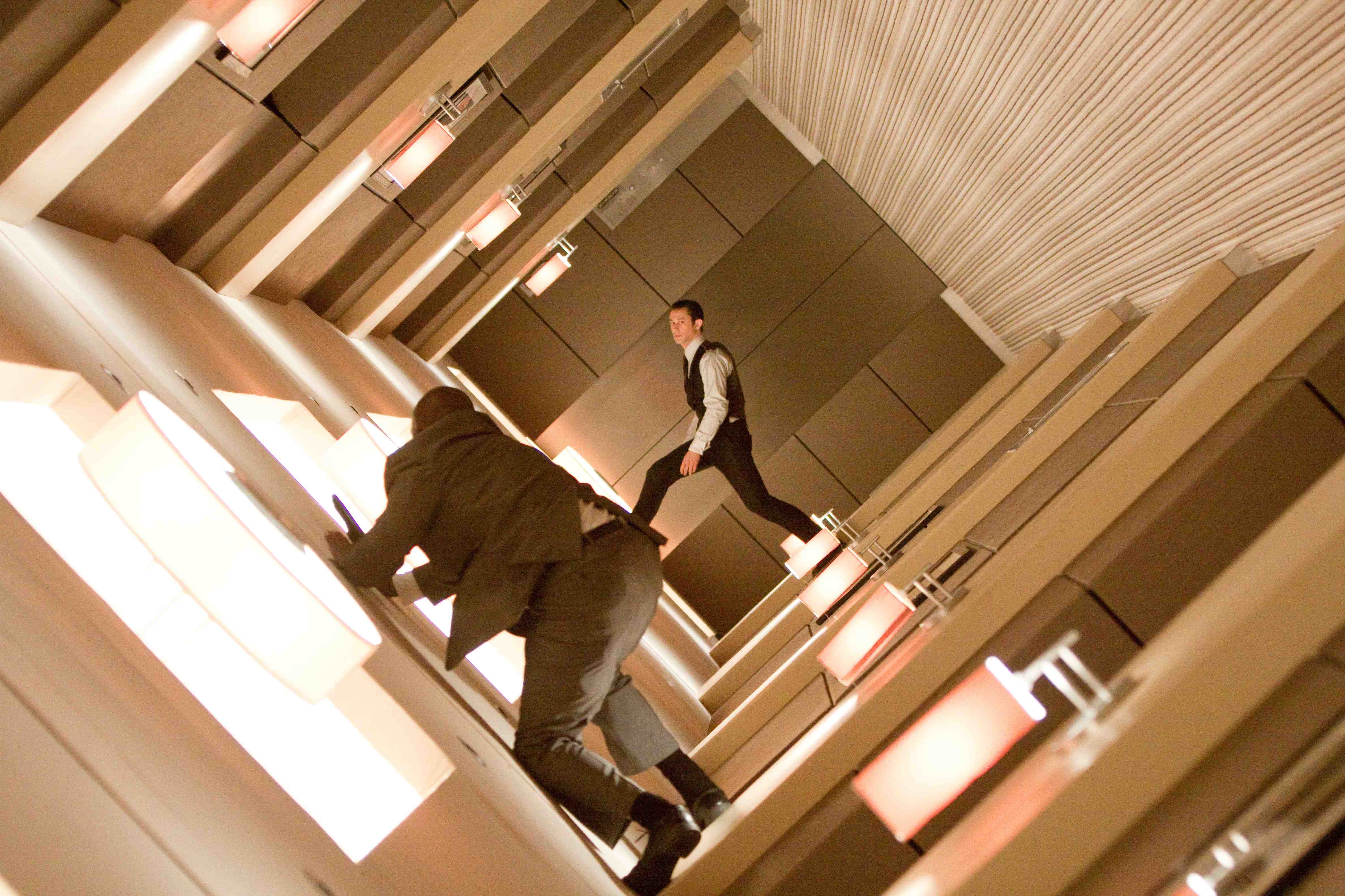 two characters from the film 'Inception' walking in a dream world where space folds back on itself
